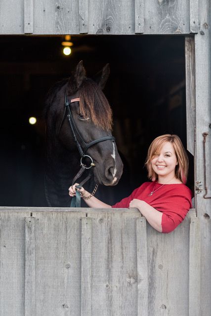 employee smiling with horse
